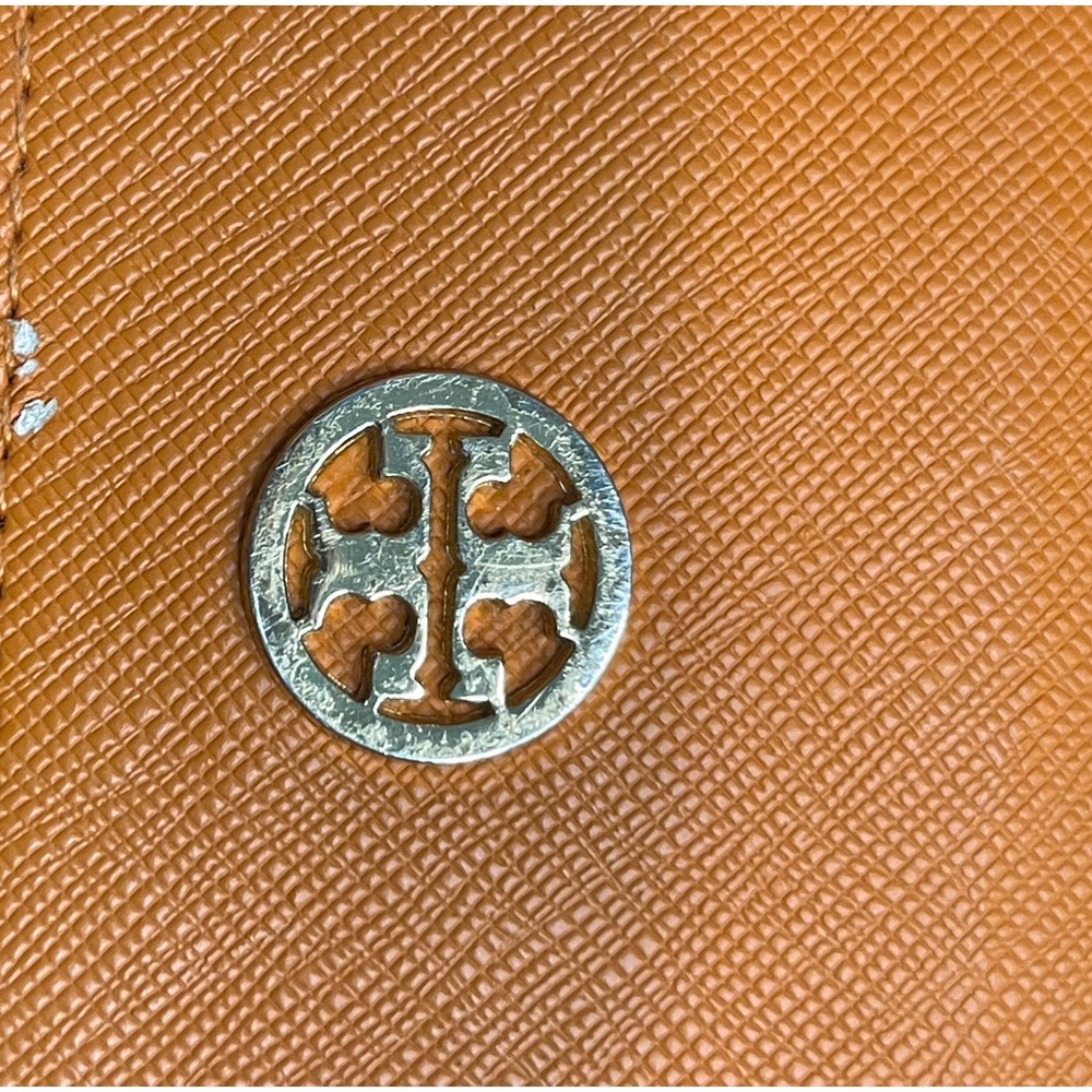 Tory Burch orange glasses case.